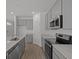 Modern kitchen with stainless steel appliances and sleek countertops at 5207 Rolling Meadow Blvd, Indianapolis, IN 46237