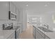 Modern kitchen with stainless steel appliances and sleek countertops at 5207 Rolling Meadow Blvd, Indianapolis, IN 46237