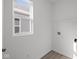Laundry Room featuring vinyl flooring, a window, and laundry hook ups at 5207 Rolling Meadow Blvd, Indianapolis, IN 46237