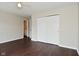Bedroom featuring hardwood floors, ceiling fan, and view to the bathroom at 5565 Noble Dr, Indianapolis, IN 46234