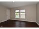 Bedroom with hardwood floors and large windows providing ample natural light at 5565 Noble Dr, Indianapolis, IN 46234