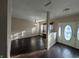 Elegant entryway with dark wood floors, decorative molding, and natural light from the front door windows at 5565 Noble Dr, Indianapolis, IN 46234