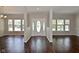 Bright foyer with dark wood floors and an oval glass front door at 5565 Noble Dr, Indianapolis, IN 46234