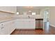 Kitchen view showcasing granite counters, stainless steel appliances, and white cabinets at 5565 Noble Dr, Indianapolis, IN 46234