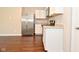 This kitchen features white cabinets, stainless steel appliances, and granite countertops at 5565 Noble Dr, Indianapolis, IN 46234