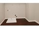 Spacious laundry area with modern hookups and wood-look flooring for easy maintenance at 5565 Noble Dr, Indianapolis, IN 46234