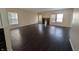 Bright and spacious living room featuring a fireplace, large windows, and stylish flooring at 5565 Noble Dr, Indianapolis, IN 46234