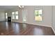 Bright living room features a fireplace, large windows, and a glass door to the backyard at 5565 Noble Dr, Indianapolis, IN 46234