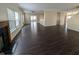Expansive living area with fireplace, multiple windows, and seamless flow to other living spaces at 5565 Noble Dr, Indianapolis, IN 46234