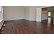 Bright living room with hardwood floors and view into an open kitchen area at 5565 Noble Dr, Indianapolis, IN 46234