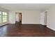 Spacious open living room with wood-look flooring, and easy access to other rooms at 5565 Noble Dr, Indianapolis, IN 46234