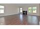 Bright living area features a fireplace and large windows, offering views of the outdoors at 5565 Noble Dr, Indianapolis, IN 46234