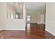 Open concept living area with durable dark wood flooring and natural light at 5565 Noble Dr, Indianapolis, IN 46234