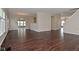Expansive living space with rich, dark hardwood flooring and an open floor plan at 5565 Noble Dr, Indianapolis, IN 46234