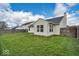 Expansive backyard showcasing a lush green lawn, complemented by well-maintained fences at 714 Breakers Ln, Fortville, IN 46040