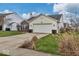Single-Gathering home with a two-car garage and well-manicured lawn at 714 Breakers Ln, Fortville, IN 46040