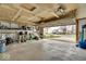 Spacious garage with an open door, equipped with shelving, tools and storage solutions at 714 Breakers Ln, Fortville, IN 46040