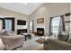 Bright living room featuring high ceilings, lots of seating, and a fireplace at 714 Breakers Ln, Fortville, IN 46040