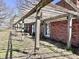 Outdoor wooden pergola with brick house and grassy area at 7180 N State Road 42, Eminence, IN 46125