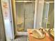 Small bathroom with a vanity, walk-in shower, and a view to the main room at 7180 N State Road 42, Eminence, IN 46125
