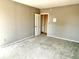 Empty bedroom featuring carpeted floors and neutral paint at 7180 N State Road 42, Eminence, IN 46125