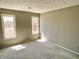 Sunlit bedroom with spacious closet, neutral paint, and large windows at 7180 N State Road 42, Eminence, IN 46125