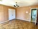 Spacious bedroom with hardwood floors, large closet, overhead light and an open doorway at 7180 N State Road 42, Eminence, IN 46125