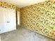 Bedroom with closet and doorway features wallpaper and carpet at 7180 N State Road 42, Eminence, IN 46125