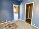 Bedroom showing doorway to a bathroom and an adjoining room at 7180 N State Road 42, Eminence, IN 46125