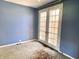 Bedroom with natural light from French doors and carpeted flooring at 7180 N State Road 42, Eminence, IN 46125