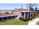 An exterior view showing the red brick, columned front, and landscaped lawn at 7180 N State Road 42, Eminence, IN 46125