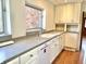 Kitchen features white cabinets, stone countertops, and modern appliances, offering a functional cooking space at 7180 N State Road 42, Eminence, IN 46125