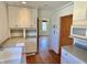 Well-lit kitchen with white cabinets and countertops, offering ample storage and workspace at 7180 N State Road 42, Eminence, IN 46125