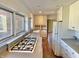 Bright kitchen with white cabinetry and gas range cooktop, providing a functional cooking space at 7180 N State Road 42, Eminence, IN 46125