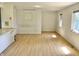 Open concept living room featuring large windows with a light-colored hardwood floor at 7180 N State Road 42, Eminence, IN 46125