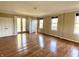 Spacious living room with hardwood floors, neutral paint, and natural light from many windows at 7180 N State Road 42, Eminence, IN 46125