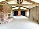 Bright, open living room featuring a brick fireplace and built-in shelving at 7180 N State Road 42, Eminence, IN 46125