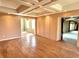 Living room featuring hardwood floors, built-in storage, and access to another room at 7180 N State Road 42, Eminence, IN 46125