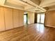 Spacious living room with hardwood flooring, built-in cabinets and coffered ceiling at 7180 N State Road 42, Eminence, IN 46125