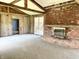 Spacious living room with wooden beams, wood paneling and a brick fireplace at 7180 N State Road 42, Eminence, IN 46125
