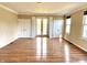 Large living room with hardwood floors, neutral paint and natural light from french doors at 7180 N State Road 42, Eminence, IN 46125