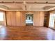 Large living room featuring hardwood floors, built-in storage, and access to the backyard at 7180 N State Road 42, Eminence, IN 46125