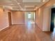 Living room featuring hardwood floors, built-in storage and coffered ceiling at 7180 N State Road 42, Eminence, IN 46125