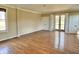 Large living room with hardwood floors, neutral paint and natural light from french doors at 7180 N State Road 42, Eminence, IN 46125