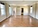 Bright living room featuring hardwood floors and natural light from large windows at 7180 N State Road 42, Eminence, IN 46125