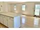 An open room with two windows that allows light to come through with white walls at 7180 N State Road 42, Eminence, IN 46125