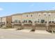 This exterior shows townhomes with attached garages and private balconies at 7247 Barker St, Carmel, IN 46033