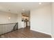 Open-concept kitchen with modern light fixtures and a view into the bright and airy living spaces at 7247 Barker St, Carmel, IN 46033