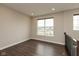 Cozy loft area with vinyl floors, a large window overlooking the neighborhood, and natural light at 7247 Barker St, Carmel, IN 46033