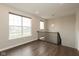 Bright loft with vinyl flooring, large windows, and modern light fixtures, creating an inviting space at 7247 Barker St, Carmel, IN 46033